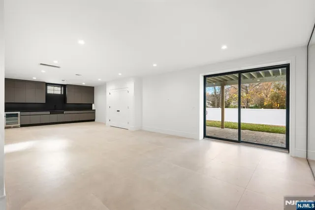 a kitchen with cabinets and a stove top oven