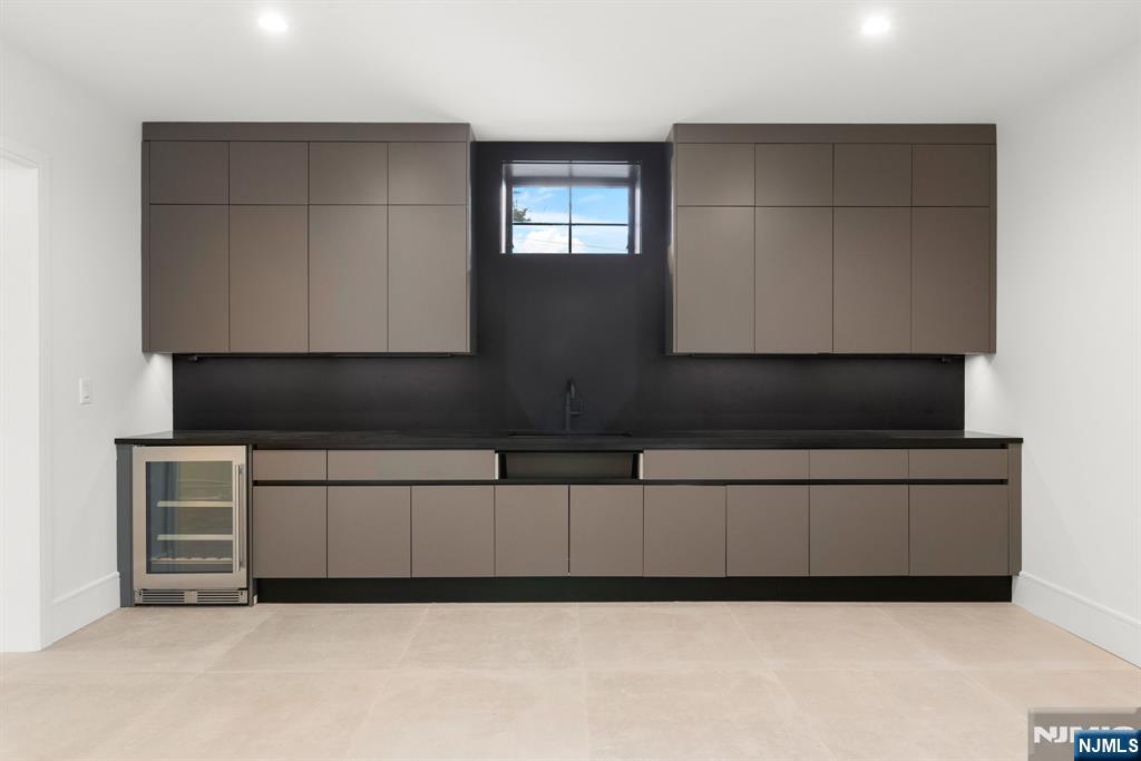 375 Burnet Place Paramus, NJ 07652 - Photo 28 of 37 a kitchen with cabinets and a stove top oven