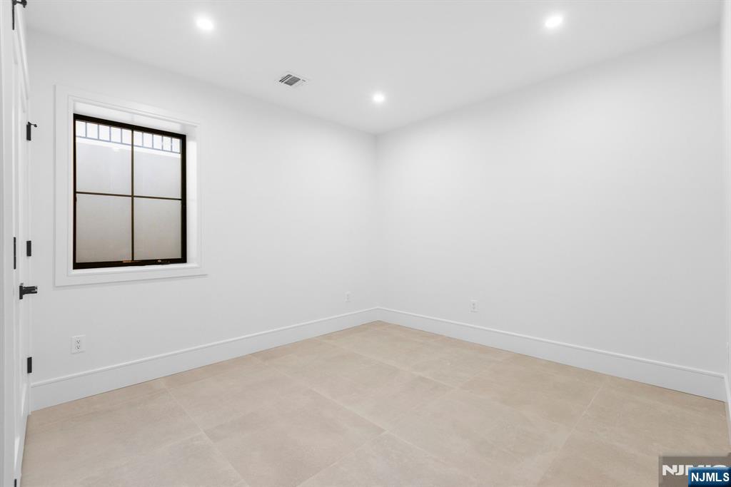 375 Burnet Place Paramus, NJ 07652 - Photo 31 of 37 an empty room with windows