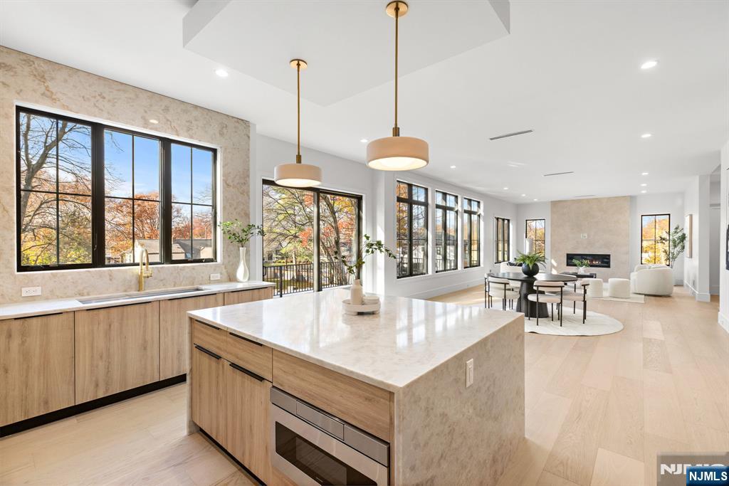 375 Burnet Place Paramus, NJ 07652 - Photo 4 of 37 a view of living room with furniture and large windows