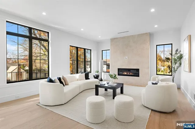 a view of a dining room with a table and chairs