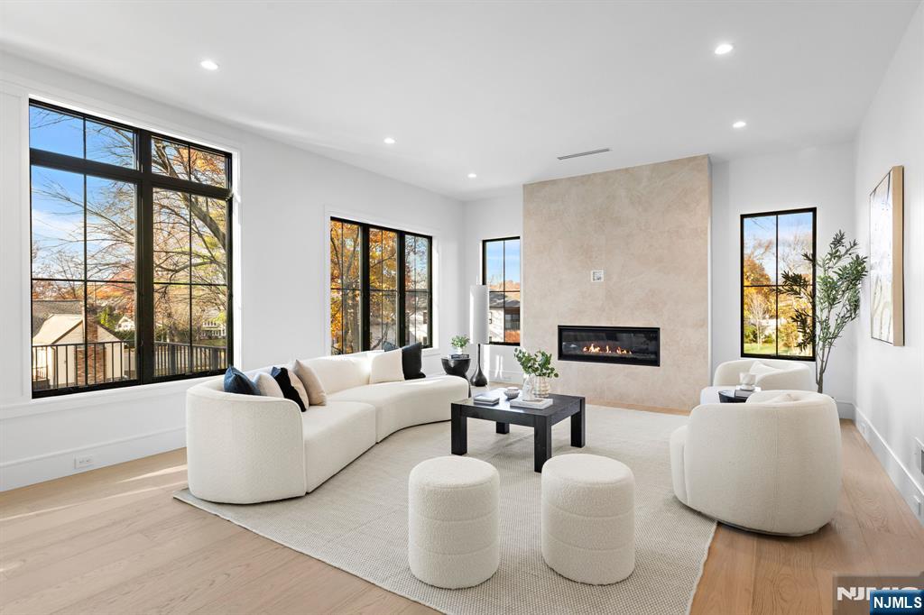 375 Burnet Place Paramus, NJ 07652 - Photo 6 of 37 a living room with furniture and a fireplace