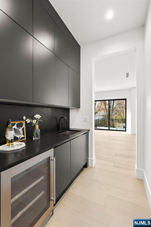 375 Burnet Place Paramus, NJ 07652 - Photo 8 of 37 a kitchen with granite countertop white cabinets and window
