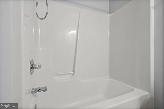 a close view of a bathtub in a bathroom