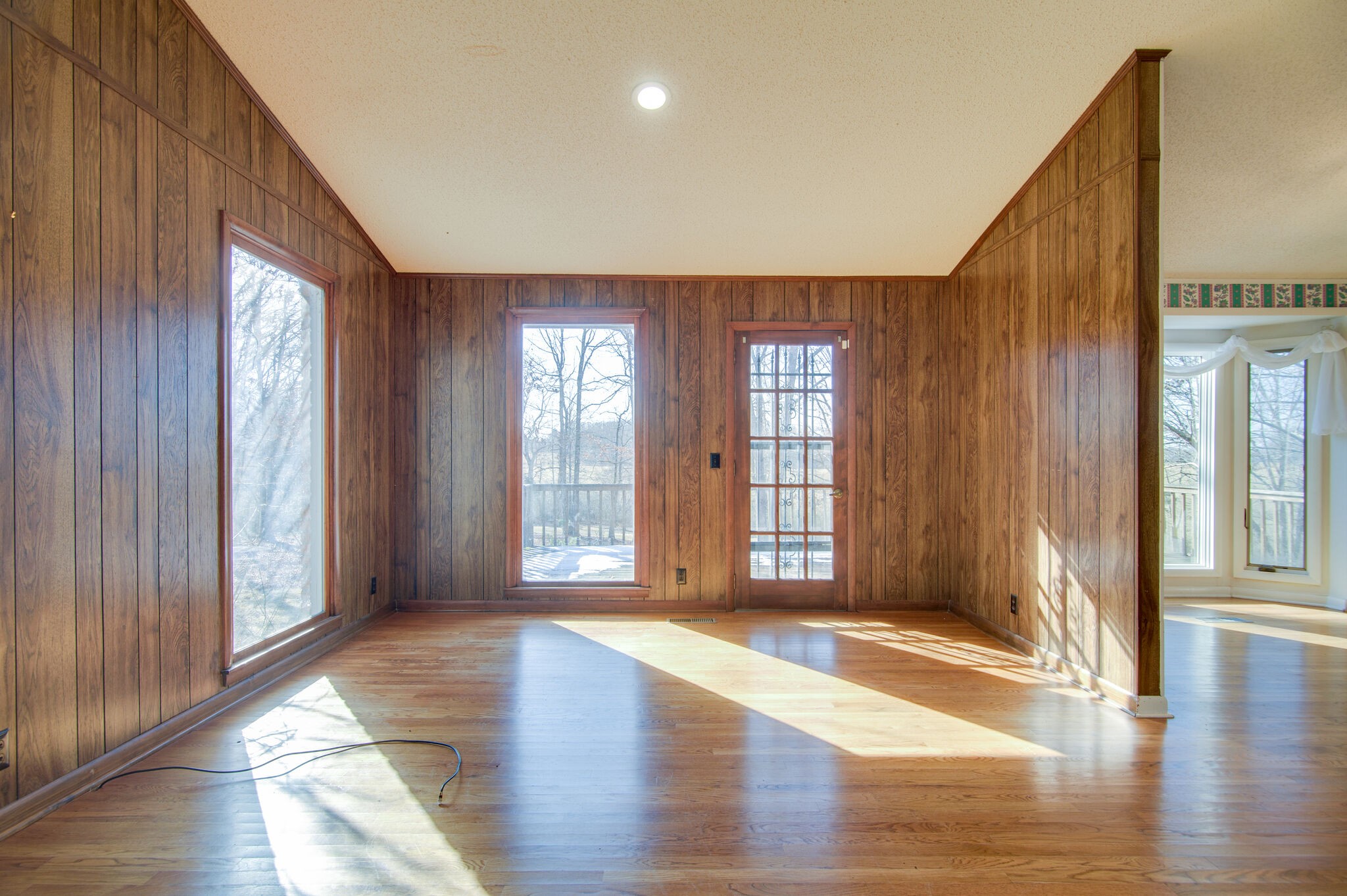 7325 Overby Road Fairview, TN 37062 - Photo 12 of 49 an empty room with wooden floor and windows