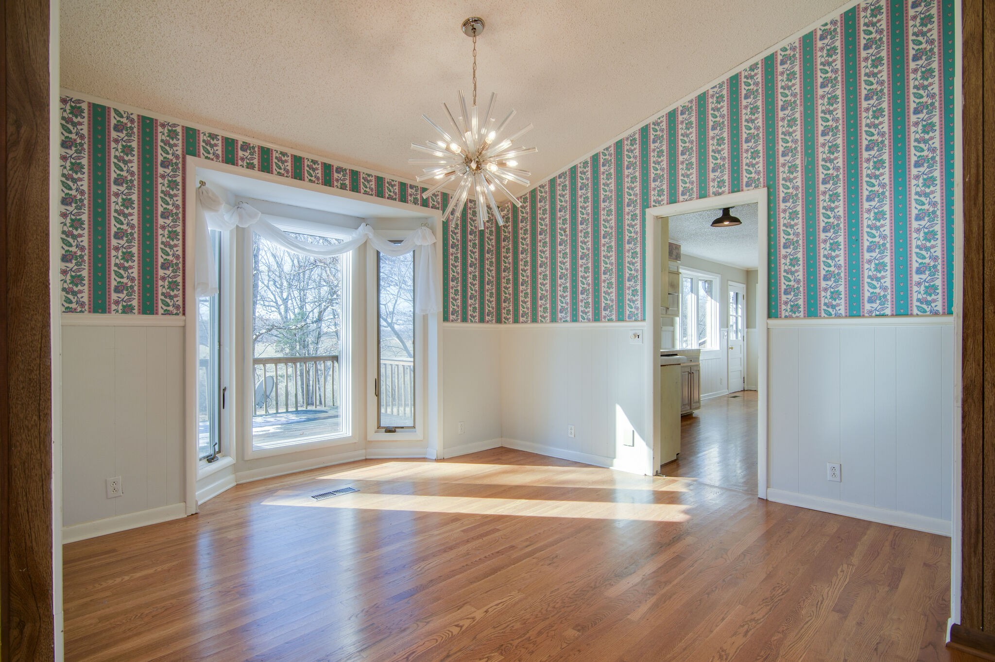7325 Overby Road Fairview, TN 37062 - Photo 13 of 49 a view of an empty room with wooden floor and a window