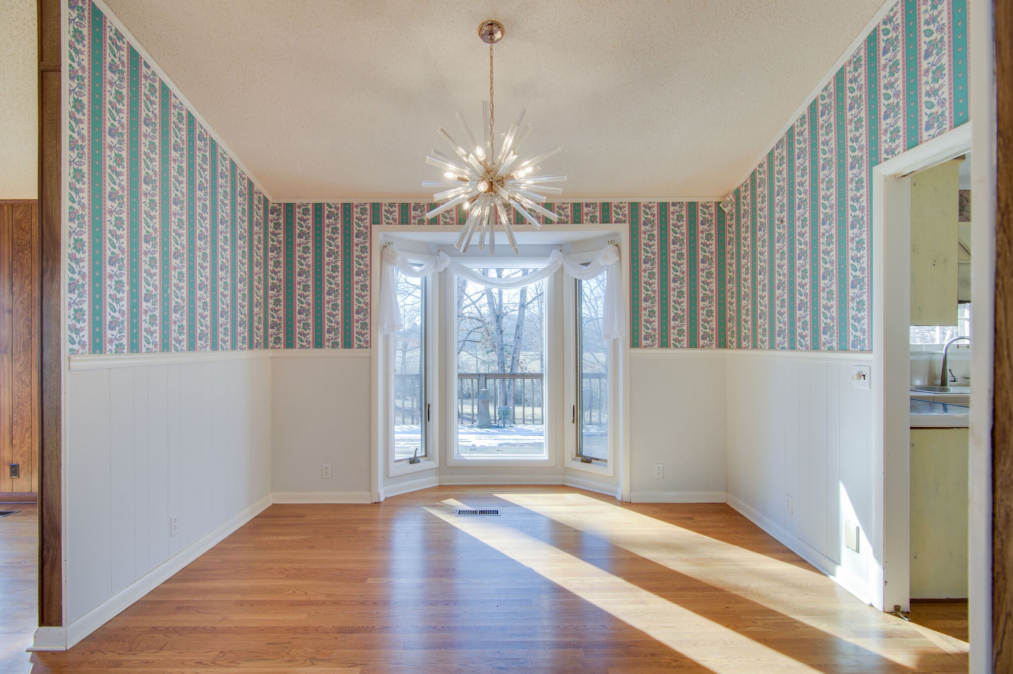 7325 Overby Road Fairview, TN 37062 - Photo 14 of 49 a view of a livingroom with a chandelier fan and windows