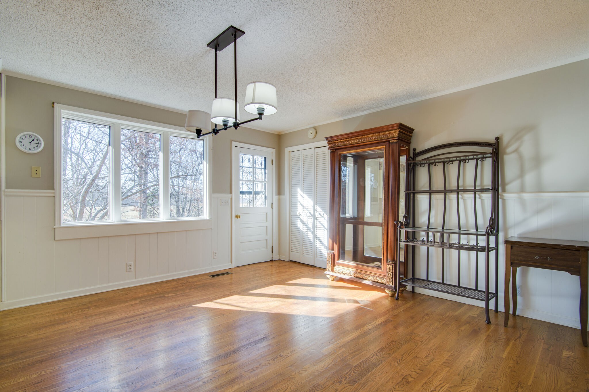 7325 Overby Road Fairview, TN 37062 - Photo 20 of 49 an empty room with wooden floor fan and windows