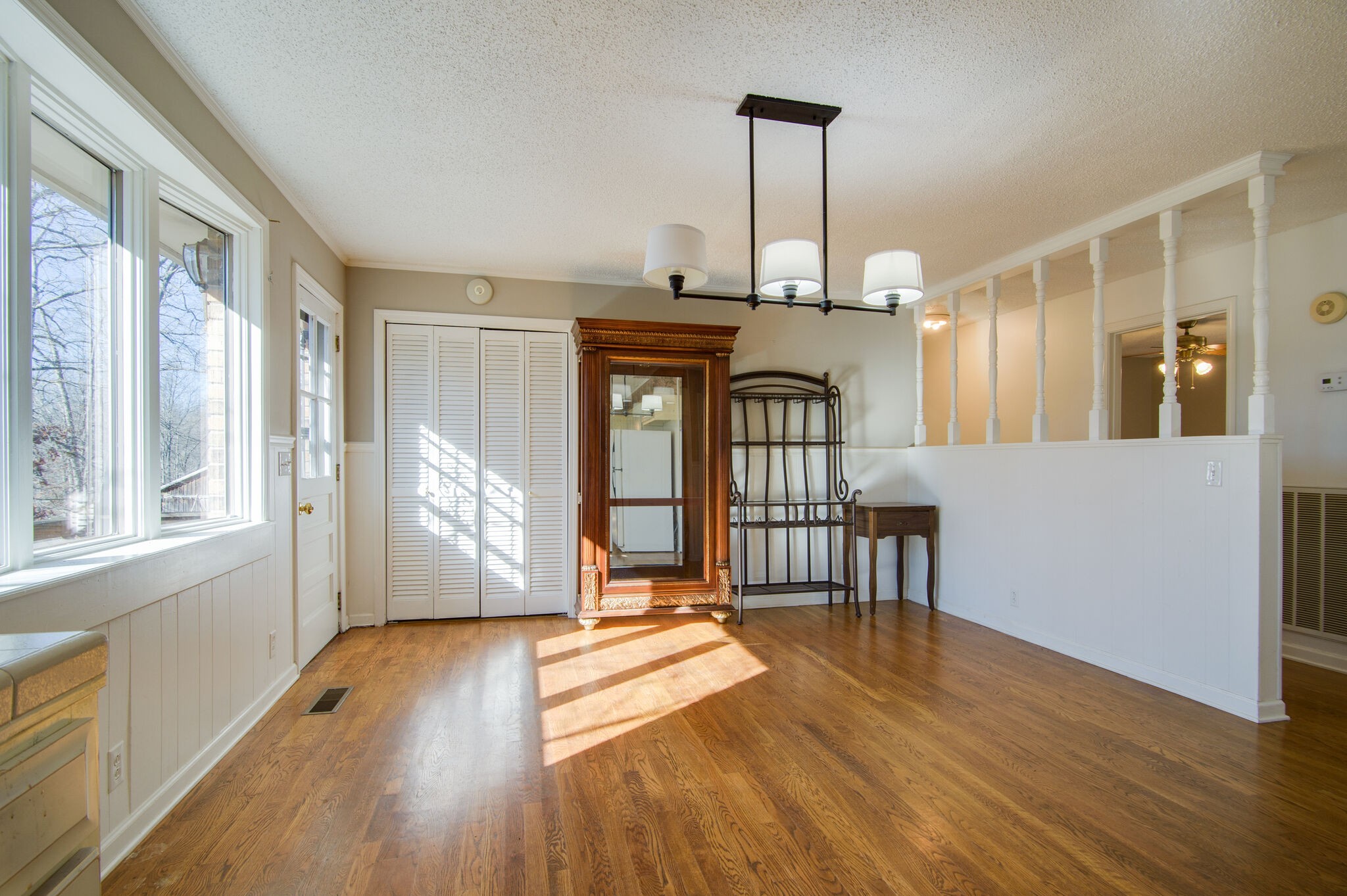 7325 Overby Road Fairview, TN 37062 - Photo 21 of 49 a view of a room with wooden floor windows and a chandelier