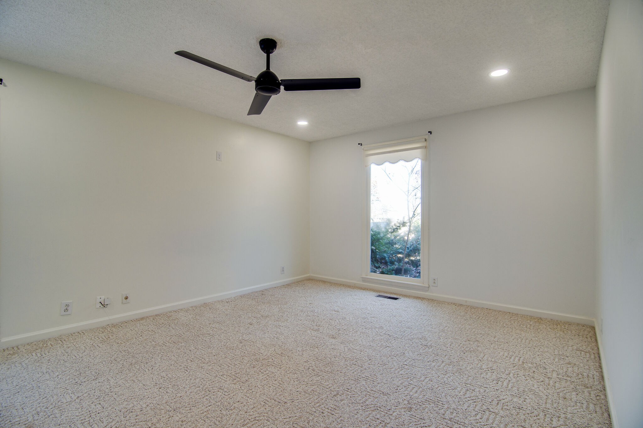 7325 Overby Road Fairview, TN 37062 - Photo 25 of 49 an empty room with a window and a ceiling fan