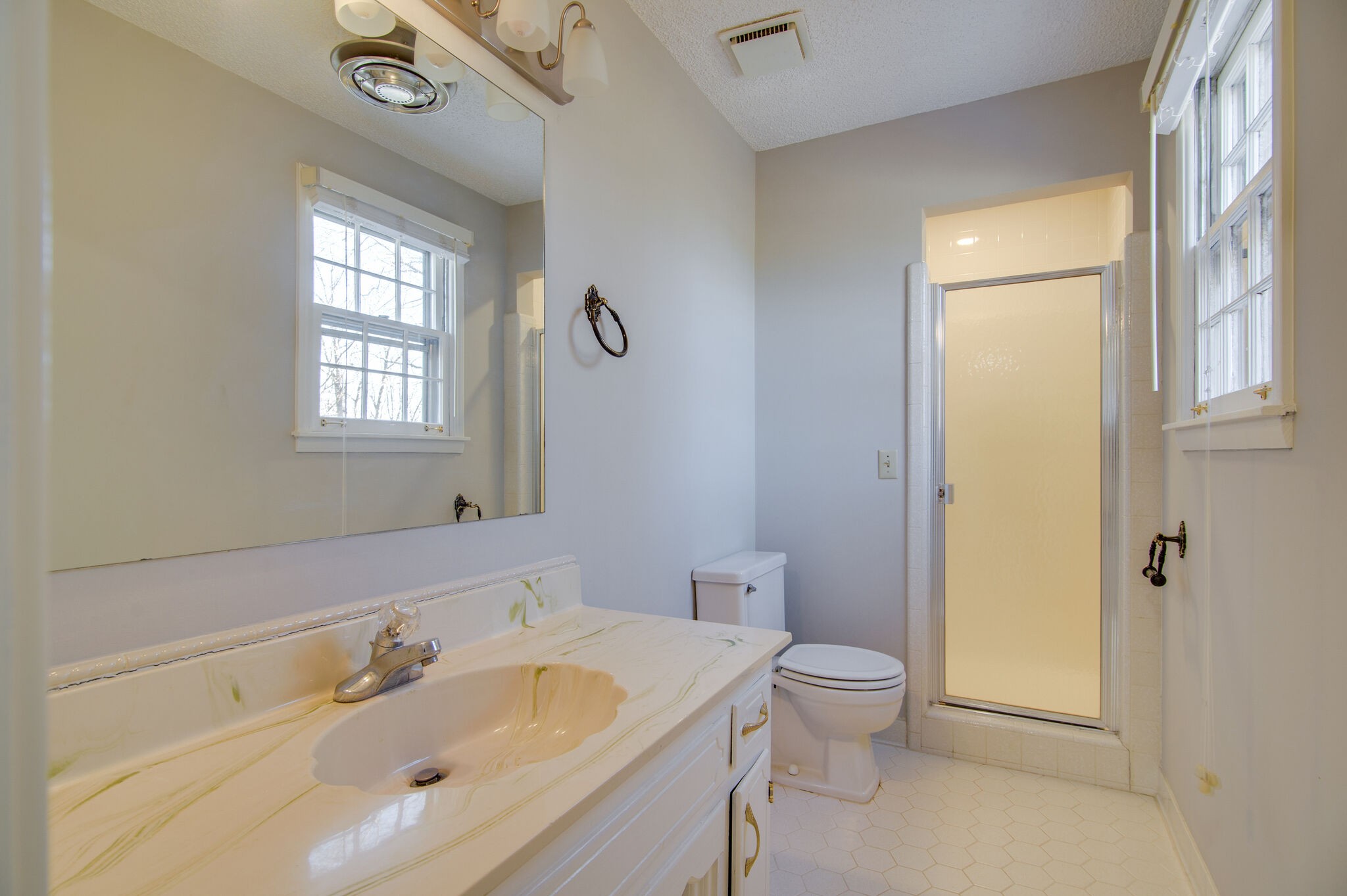 7325 Overby Road Fairview, TN 37062 - Photo 27 of 49 a bathroom with a sink a toilet and shower