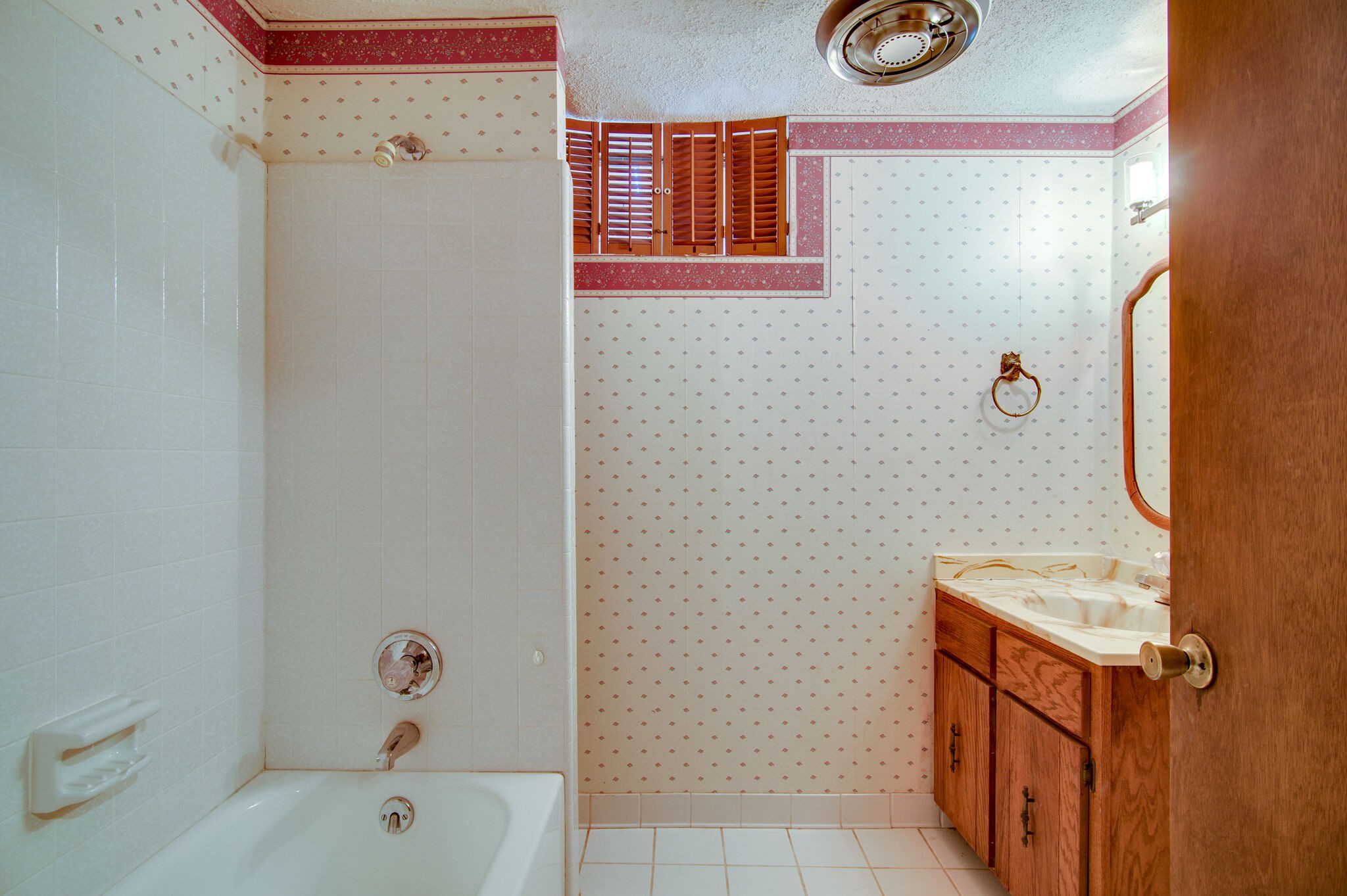 7325 Overby Road Fairview, TN 37062 - Photo 31 of 49 a bathroom with a tub sink and mirror