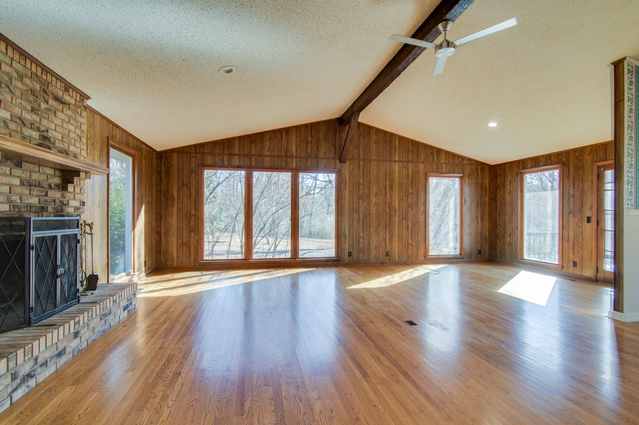 7325 Overby Road Fairview, TN 37062 - Photo 9 of 49 a view of an empty room with wooden floor and a window