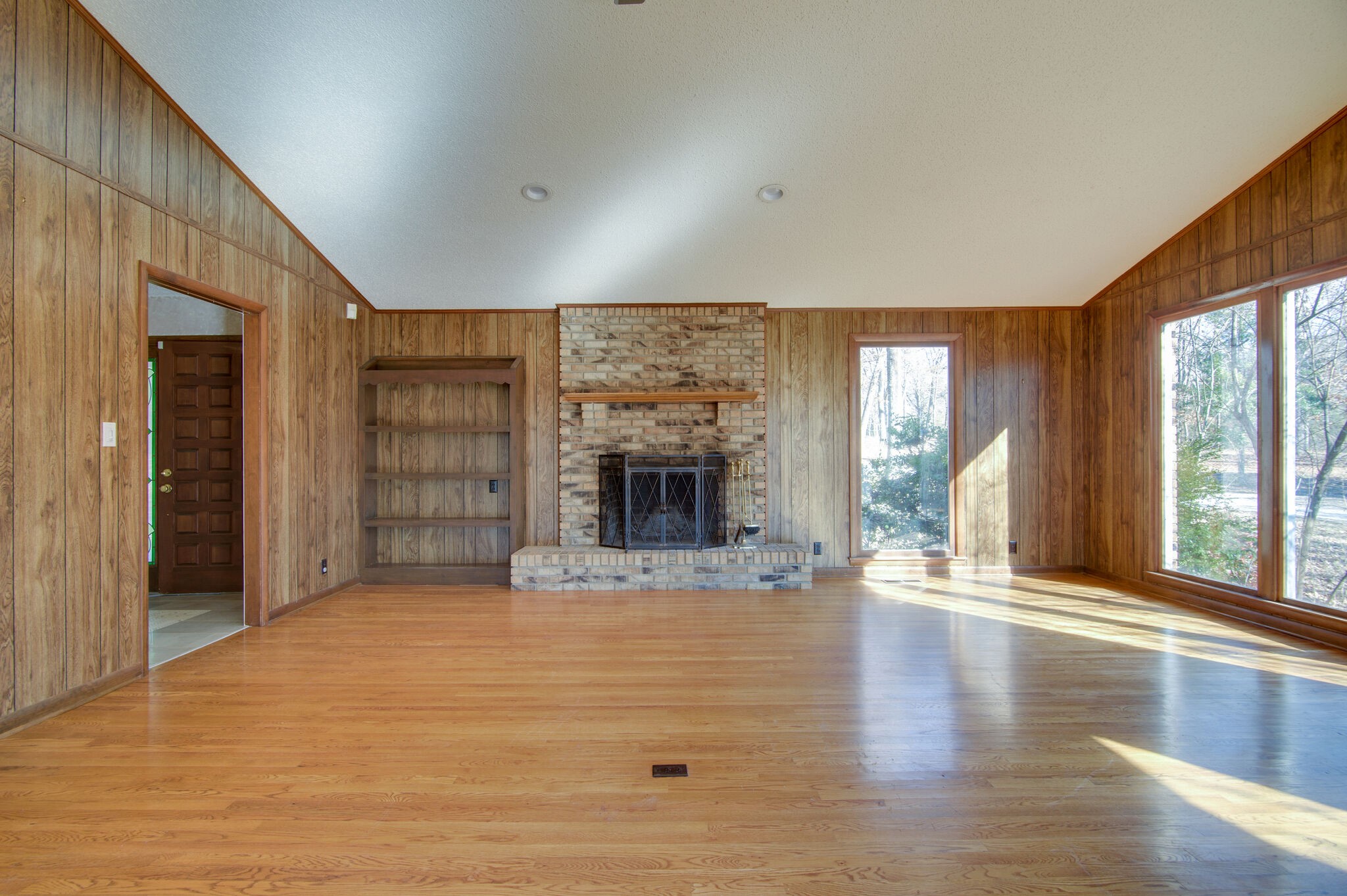 7325 Overby Road Fairview, TN 37062 - Photo 10 of 49 a view of an empty room with a fireplace and a window