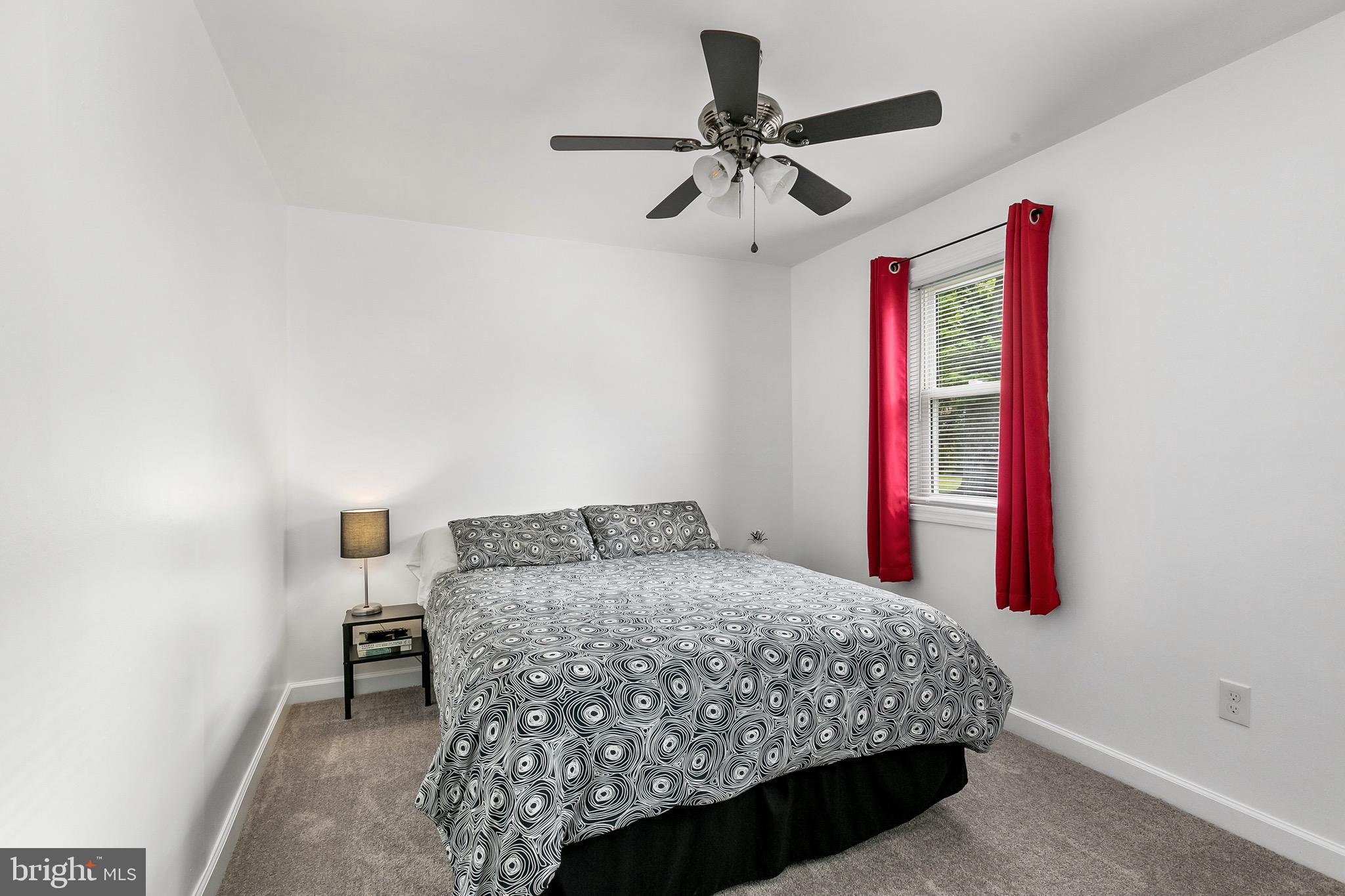 59 Chest-Georgetown Road Columbus, NJ 08022 - Photo 16 of 30 a bedroom with a bed and a chandelier