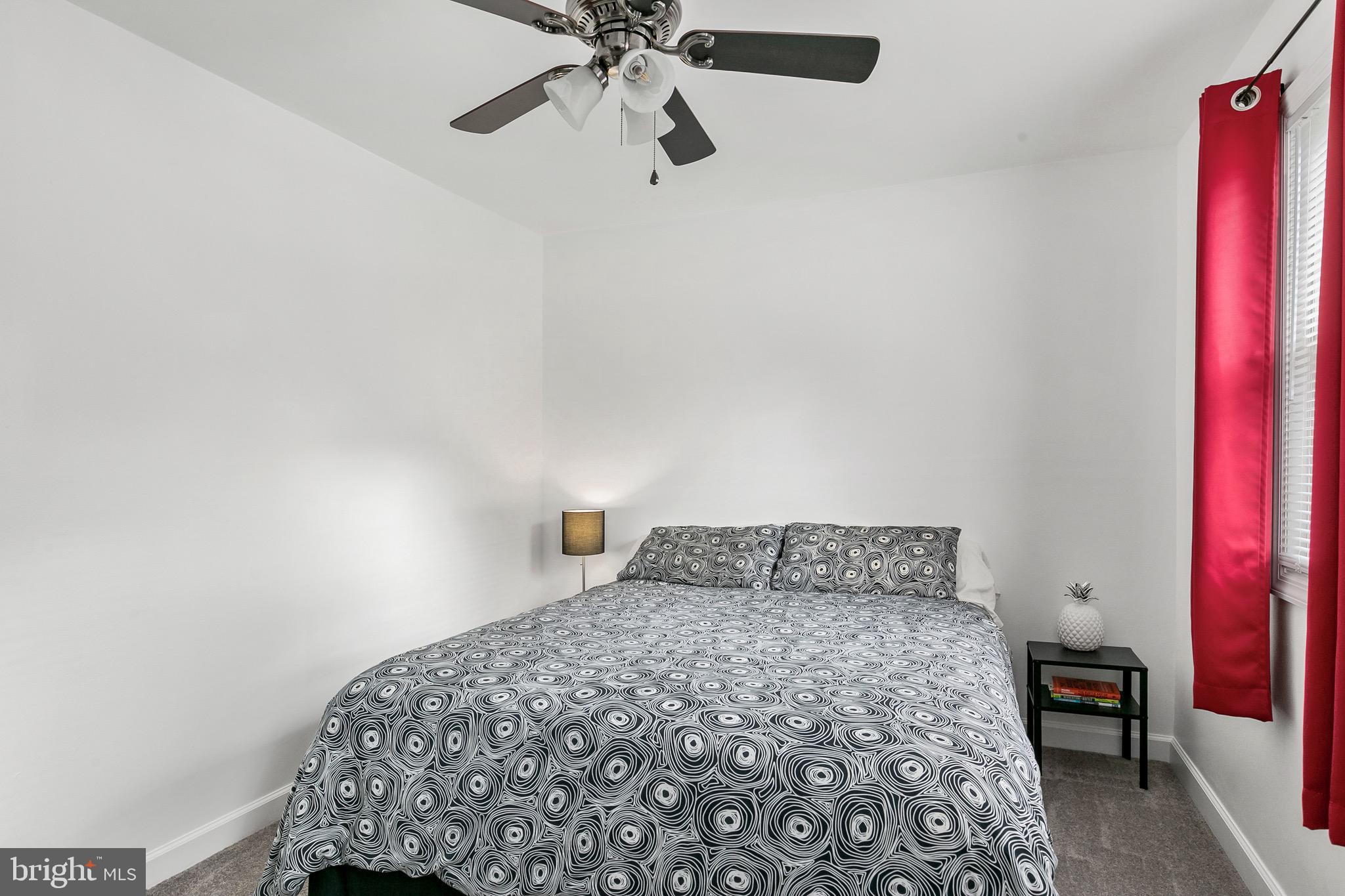 59 Chest-Georgetown Road Columbus, NJ 08022 - Photo 17 of 30 a bedroom with a bed and a chandelier