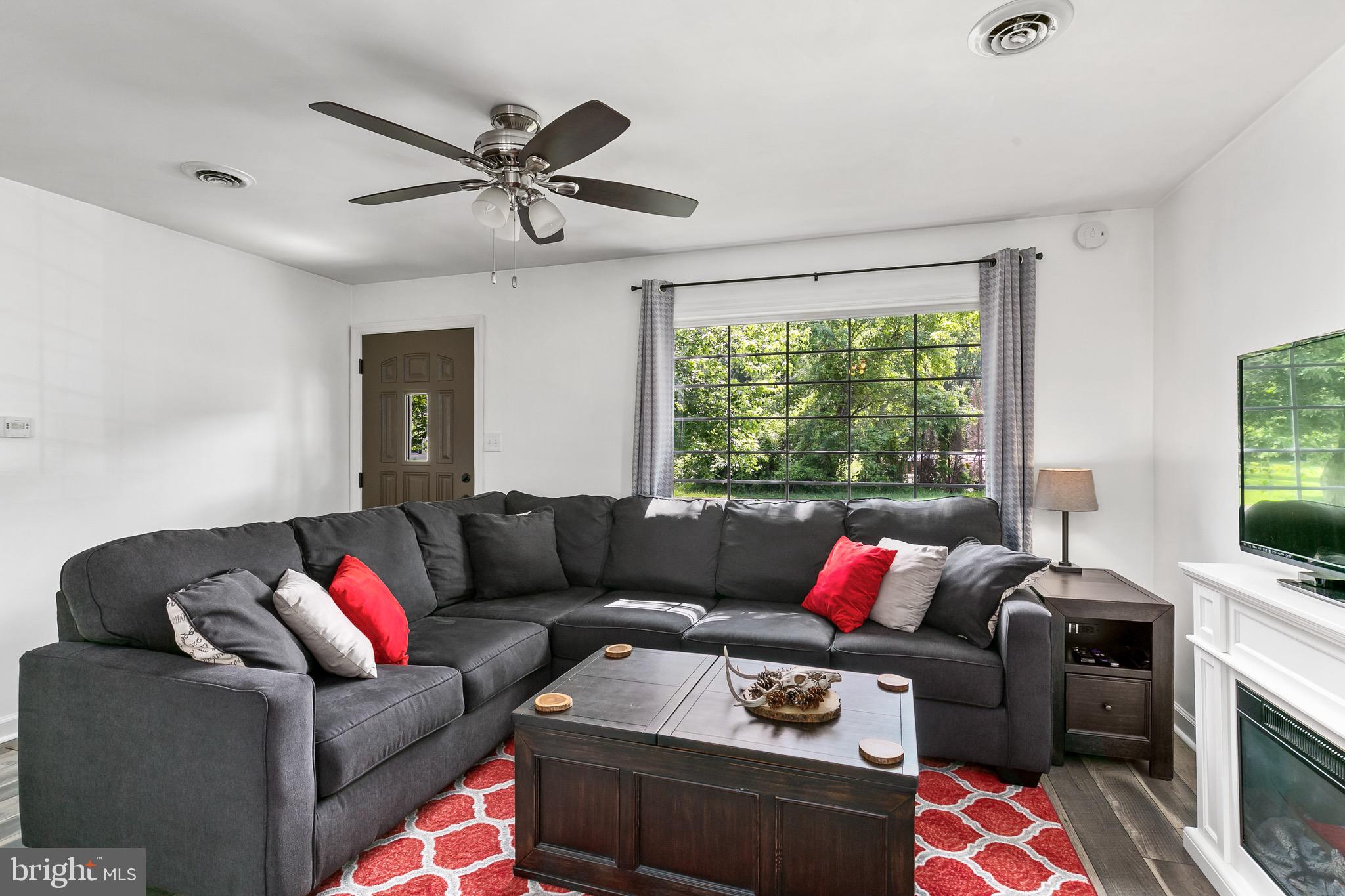 59 Chest-Georgetown Road Columbus, NJ 08022 - Photo 5 of 30 a living room with furniture ceiling fan and a window