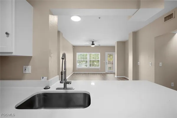 a kitchen with a sink and a window
