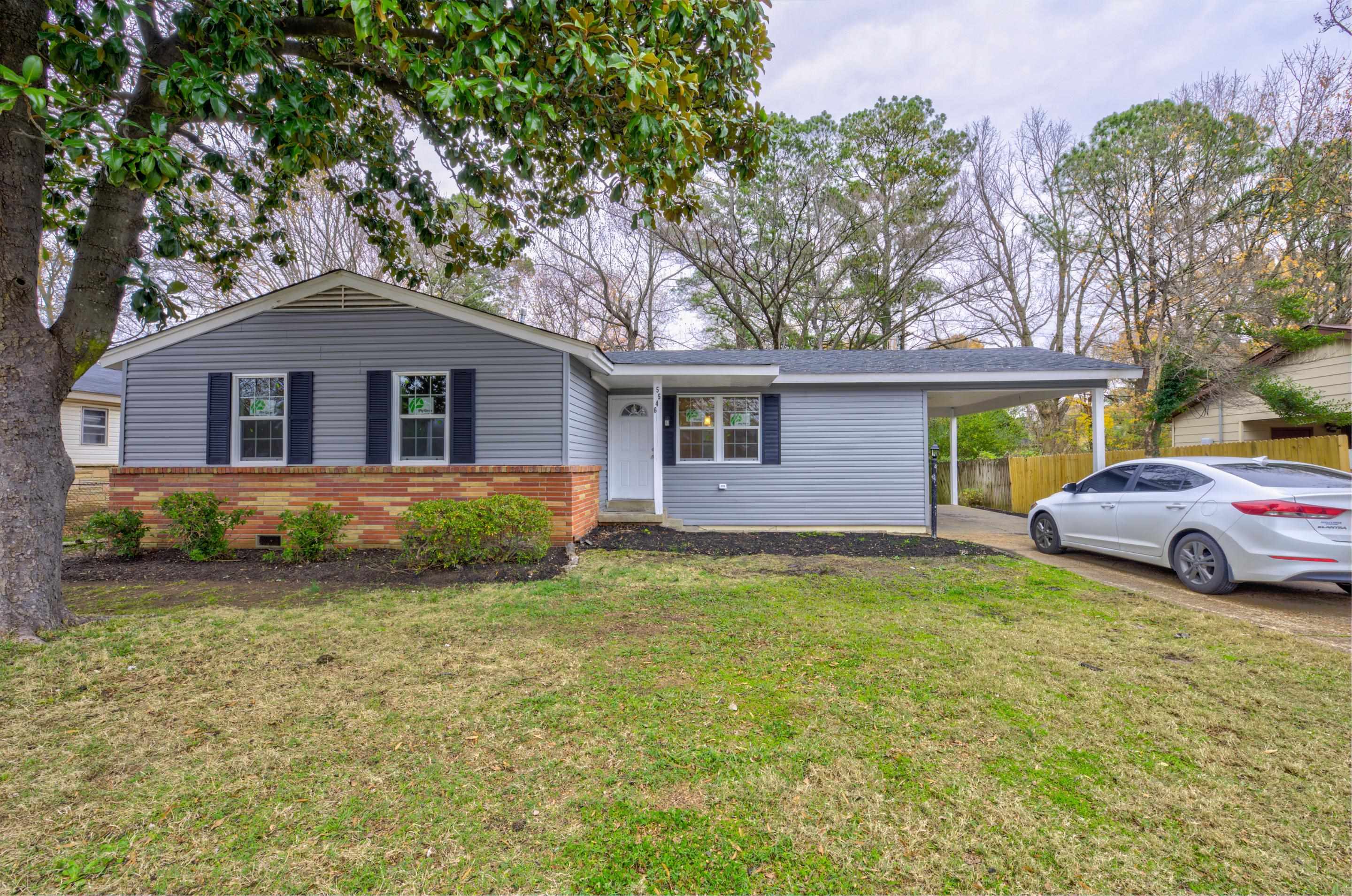 5546 Millbranch Road Memphis, TN 38116 - Photo 1 of 24 a house view with a garden space