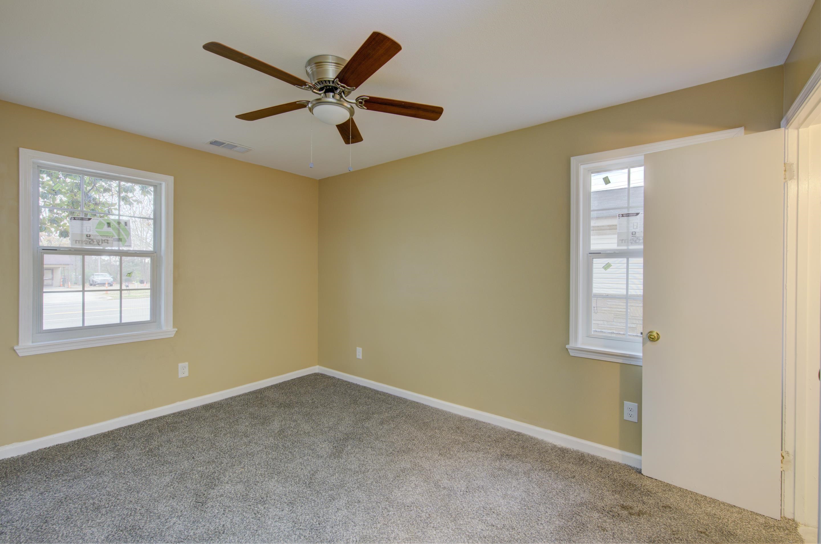 5546 Millbranch Road Memphis, TN 38116 - Photo 12 of 24 a view of an empty room with a window
