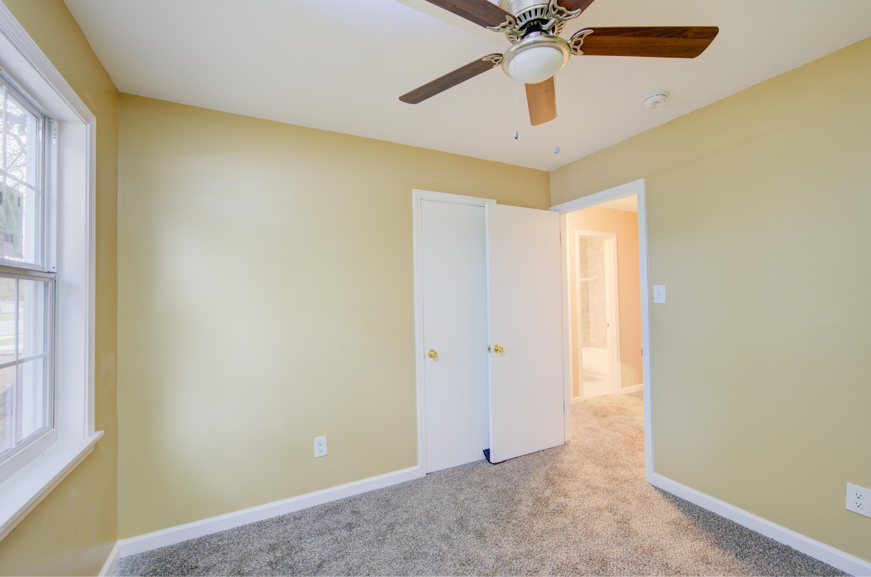 5546 Millbranch Road Memphis, TN 38116 - Photo 16 of 24 a view of an empty room with a window