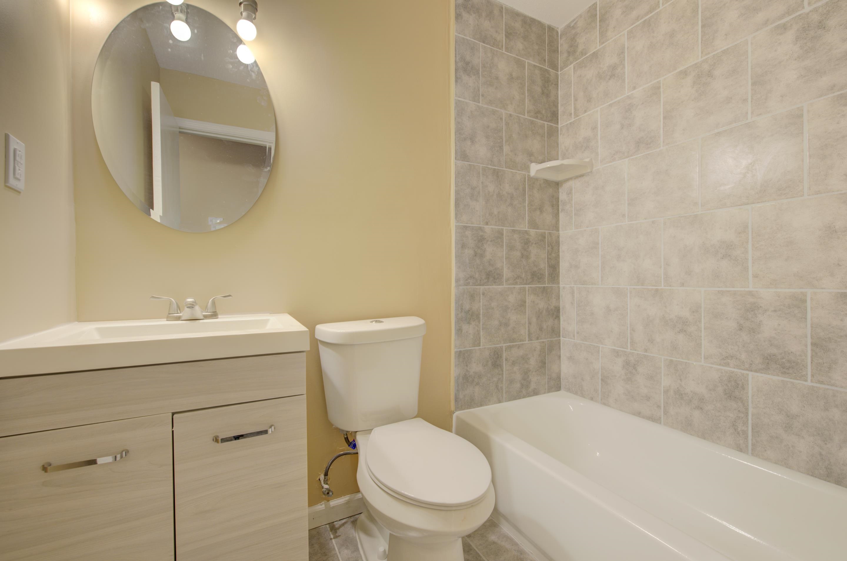 5546 Millbranch Road Memphis, TN 38116 - Photo 17 of 24 a bathroom with a sink toilet and shower