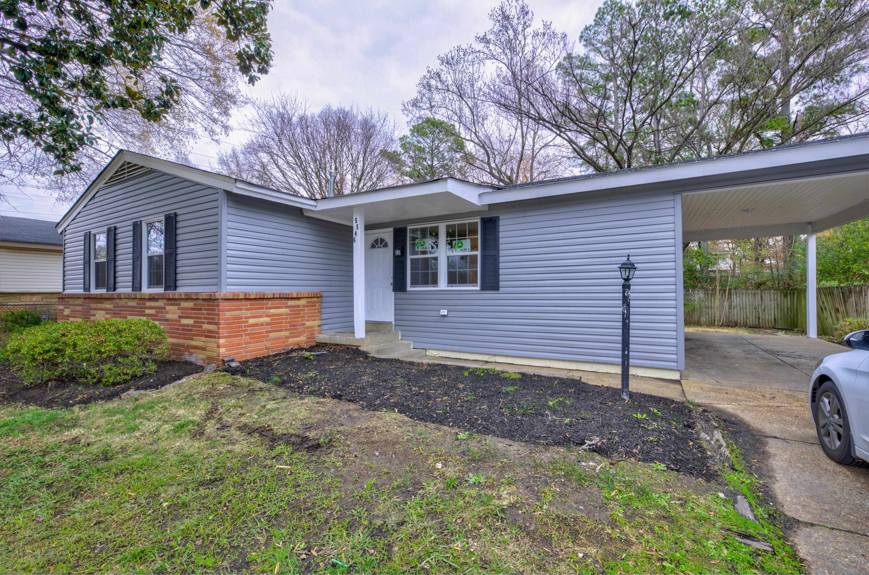 5546 Millbranch Road Memphis, TN 38116 - Photo 3 of 24 a view of a house with a yard