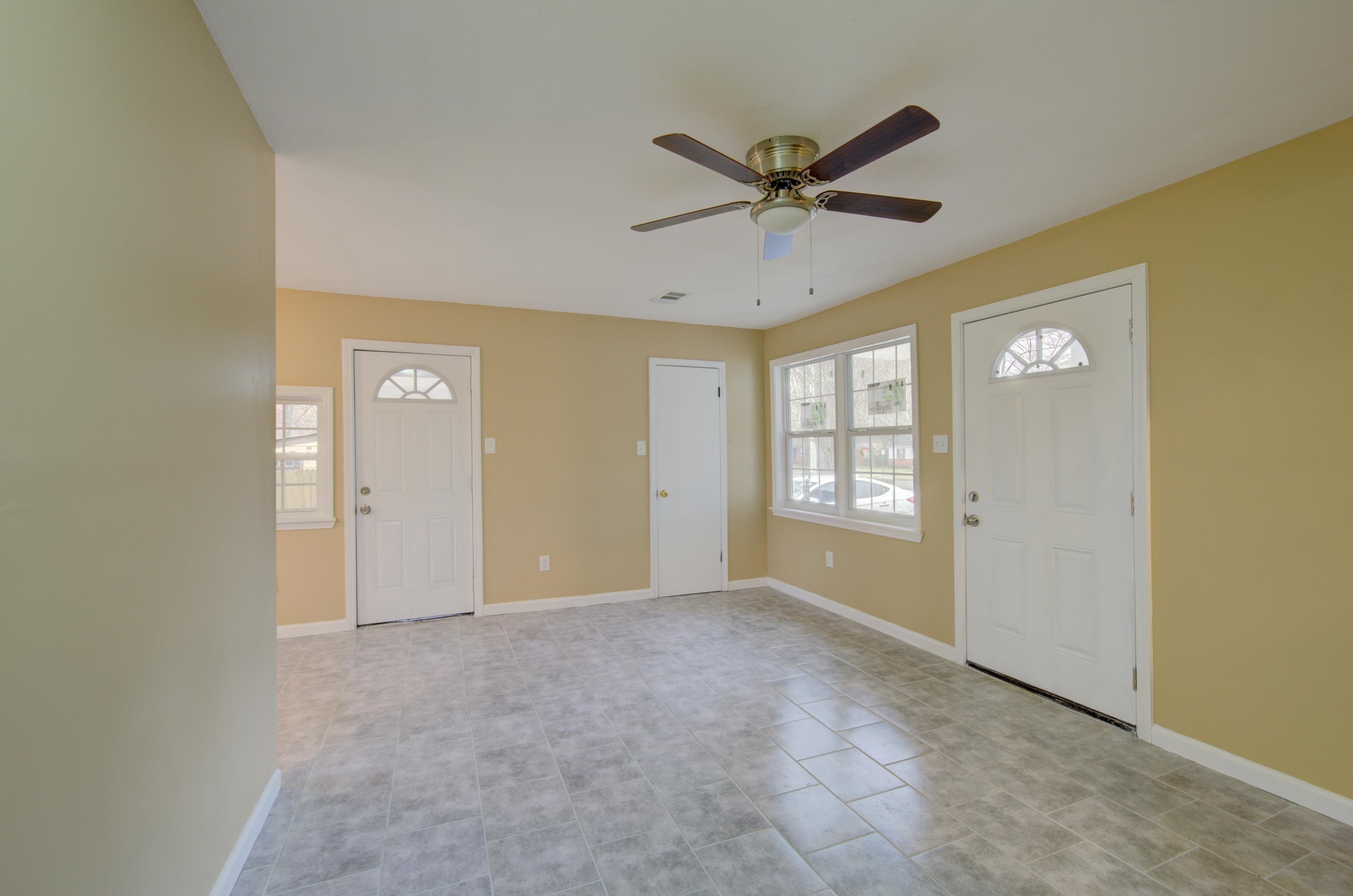 5546 Millbranch Road Memphis, TN 38116 - Photo 5 of 24 a view of an empty room and window