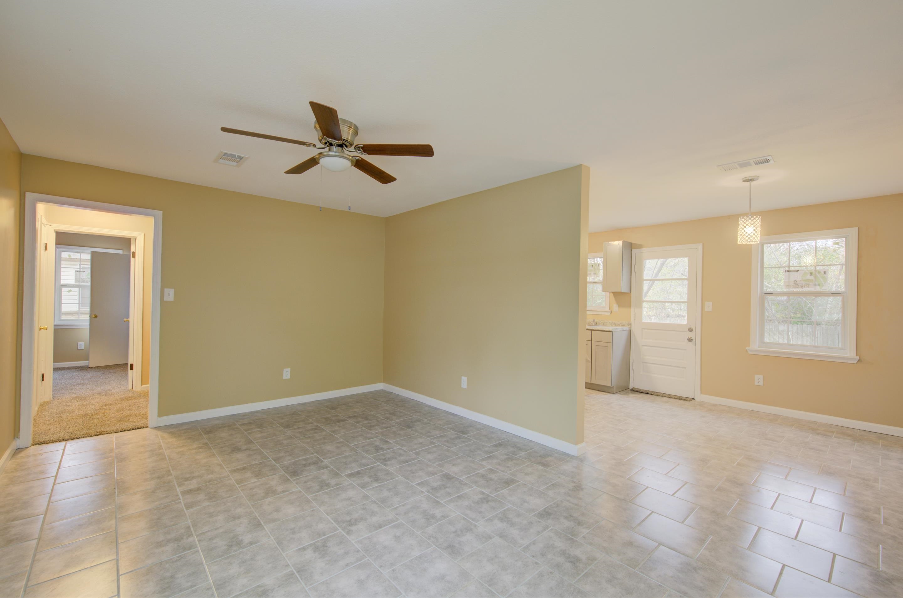 5546 Millbranch Road Memphis, TN 38116 - Photo 7 of 24 a view of an empty room with a window