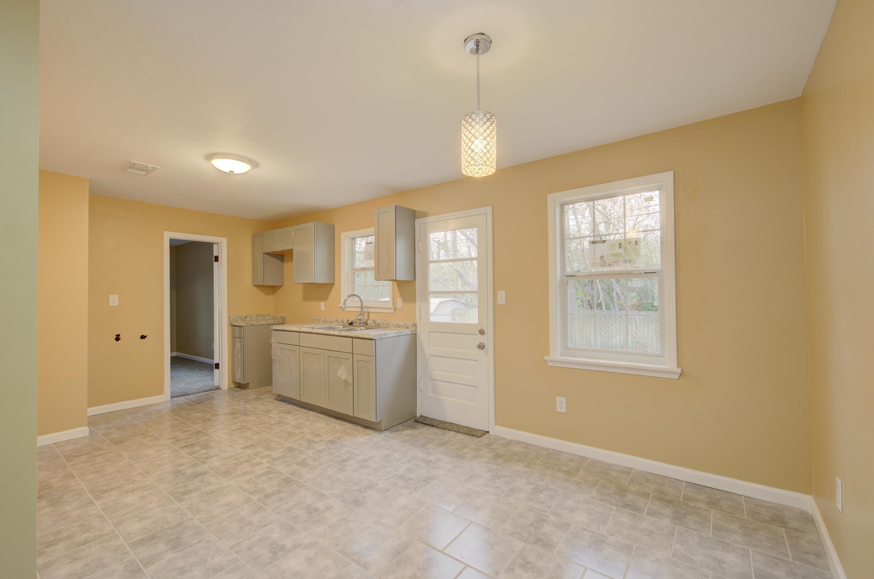 5546 Millbranch Road Memphis, TN 38116 - Photo 8 of 24 a view of a kitchen with furniture and window
