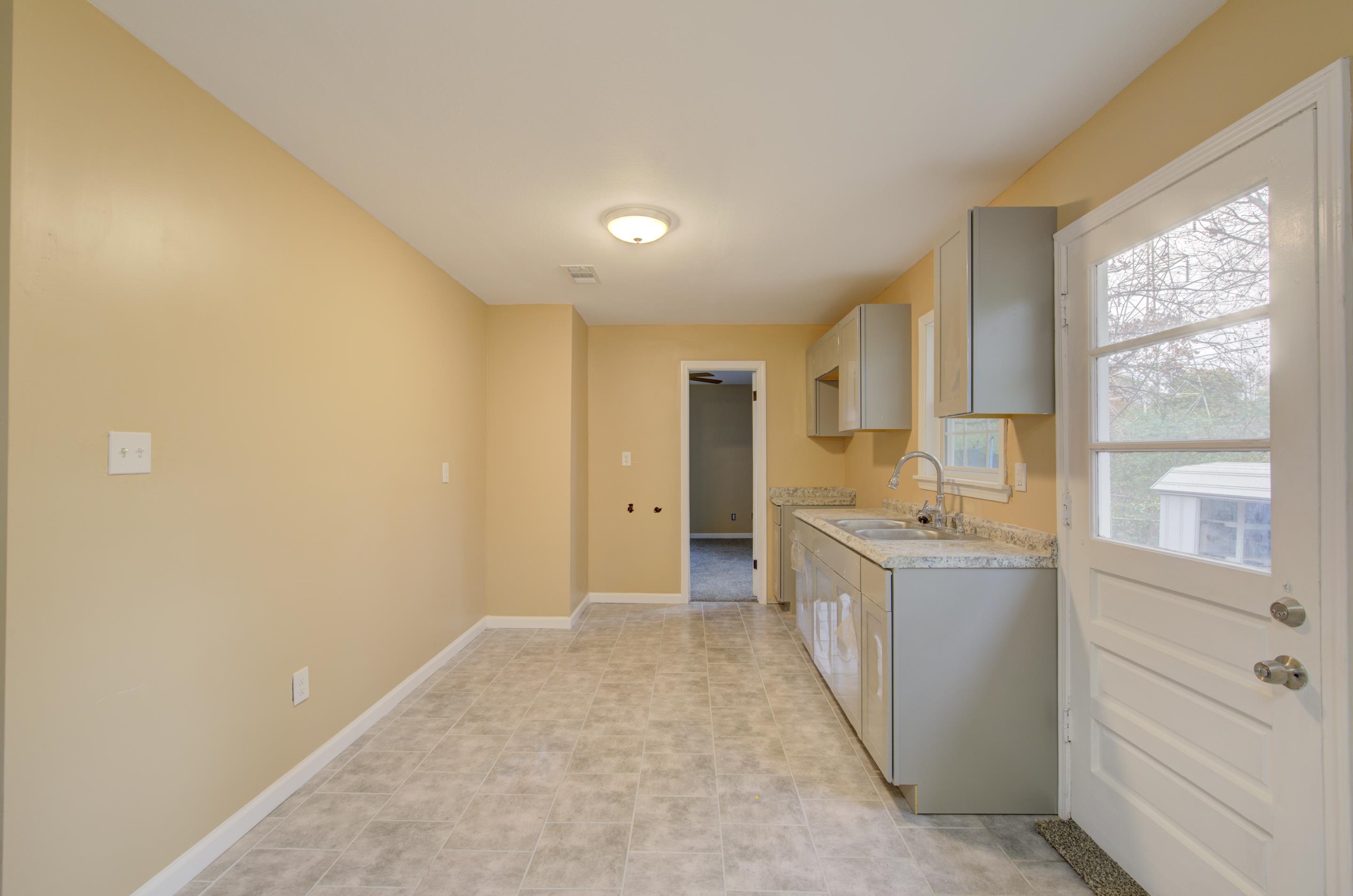 5546 Millbranch Road Memphis, TN 38116 - Photo 9 of 24 a bathroom with a granite countertop sink mirror and a bathtub