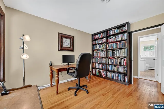 a workspace with furniture window and wooden floor