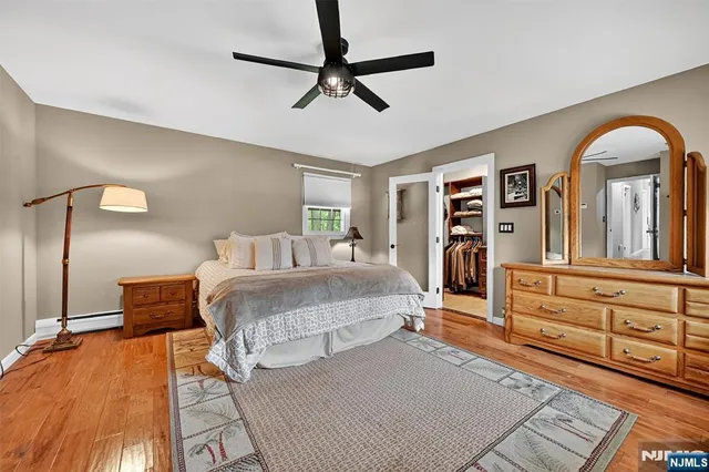 a bed room with a bed and a dresser