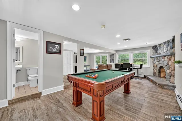 a room with furniture and pool table