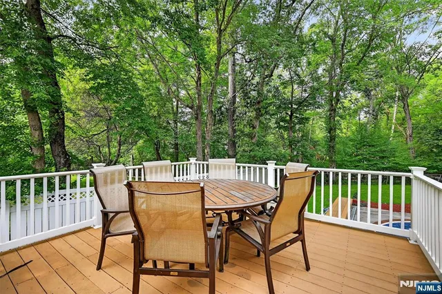 a view of a chair and table on the deck
