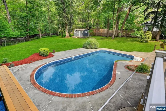 a view of a swimming pool with a garden