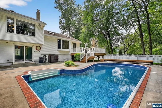 a view of swimming pool with lounge chair