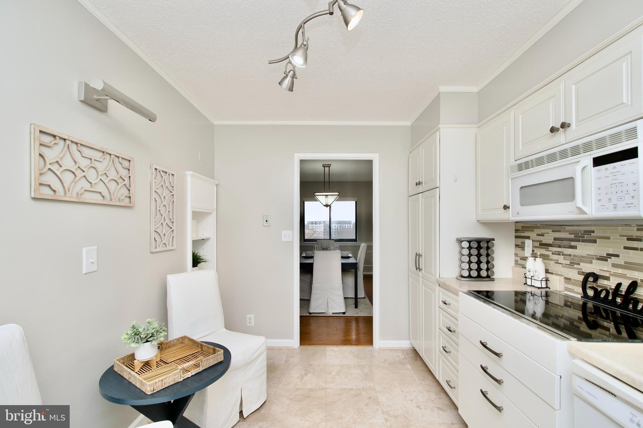 5902 Mt Eagle Drive, Unit 905 Alexandria, VA 22303 - Photo 13 of 55 a living room with stainless steel appliances kitchen island granite countertop furniture and a view of living room