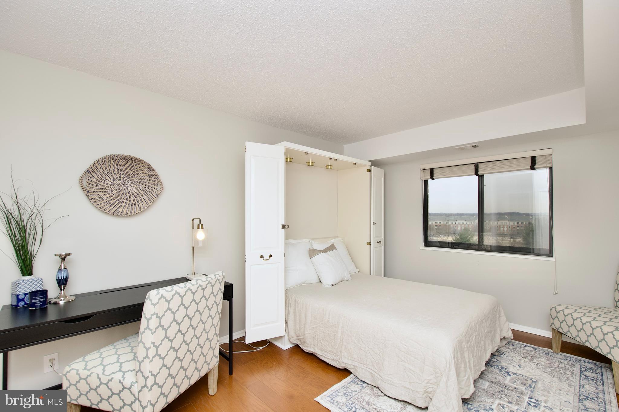 5902 Mt Eagle Drive, Unit 905 Alexandria, VA 22303 - Photo 19 of 55 a bedroom with bed and a window