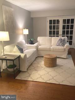 5902 Mt Eagle Drive, Unit 905 Alexandria, VA 22303 - Photo 51 of 55 a living room with furniture and a large window