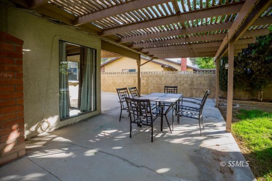 1025 Scott Street Ridgecrest, CA 93555 - Photo 29 of 29 a view of a patio with table and chairs and potted plants