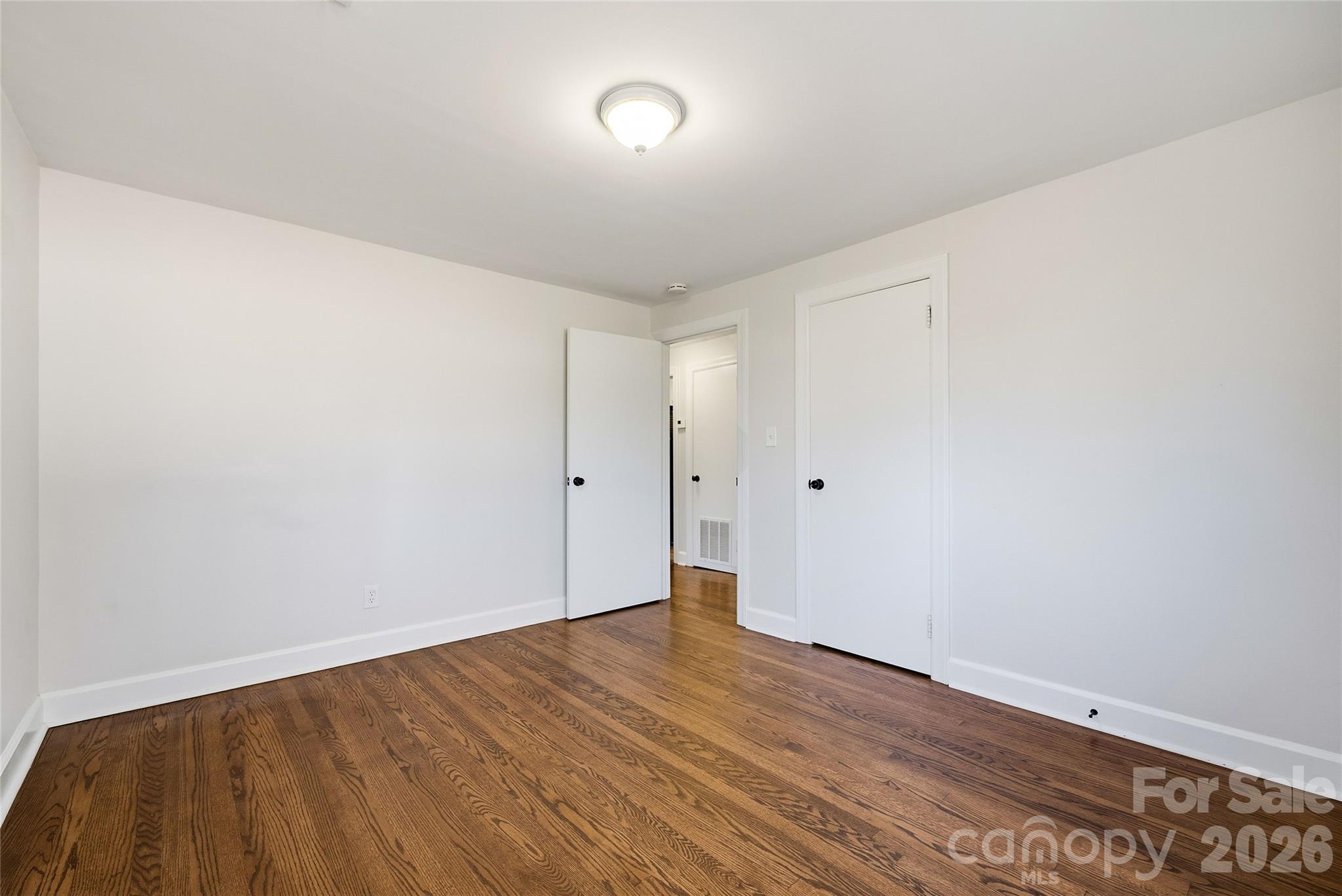 718 2nd Avenue Northeast Conover, NC 28613 - Photo 14 of 29 a view of an empty room with wooden floor