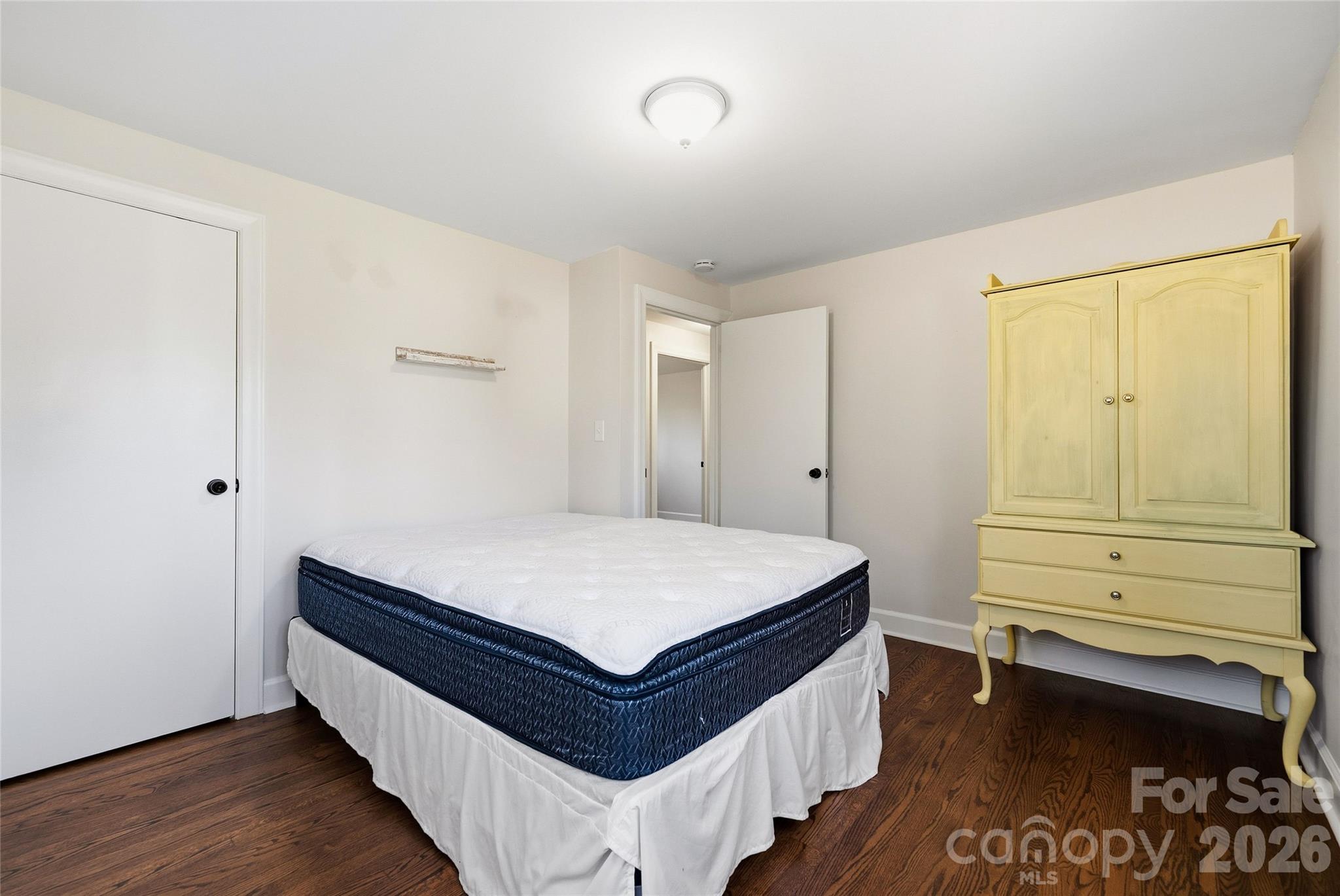 718 2nd Avenue Northeast Conover, NC 28613 - Photo 16 of 29 a room with a bed and cabinet