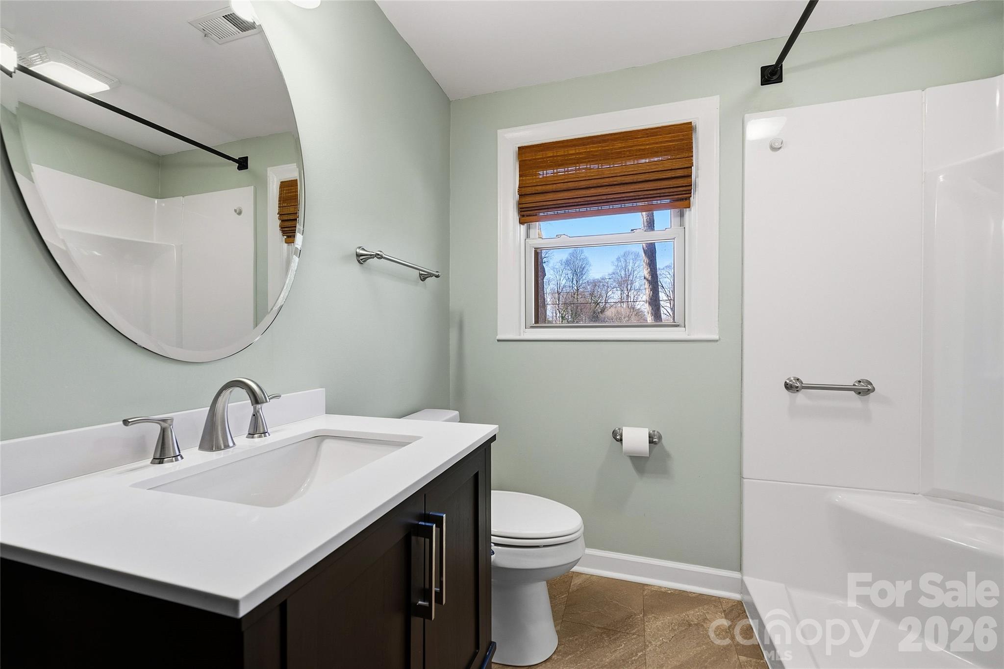 718 2nd Avenue Northeast Conover, NC 28613 - Photo 17 of 29 a bathroom with a sink a toilet and shower