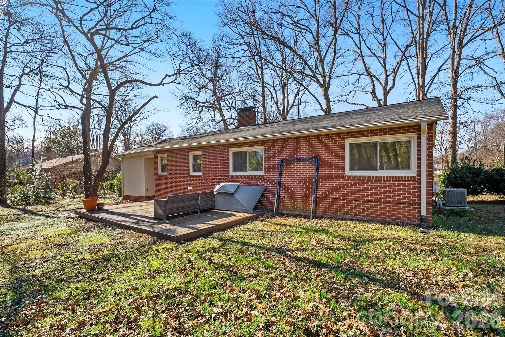 718 2nd Avenue Northeast Conover, NC 28613 - Photo 21 of 29 a backyard of a house with yard and outdoor seating
