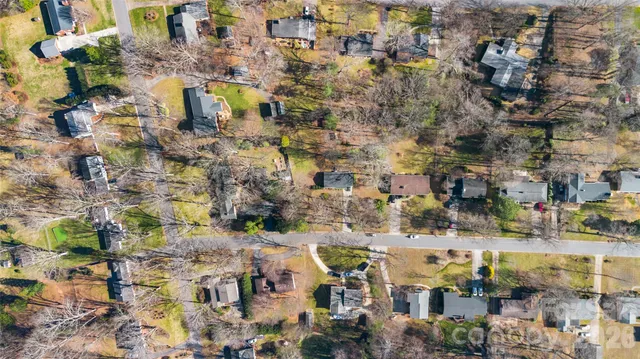 a aerial view of residential houses with outdoor space