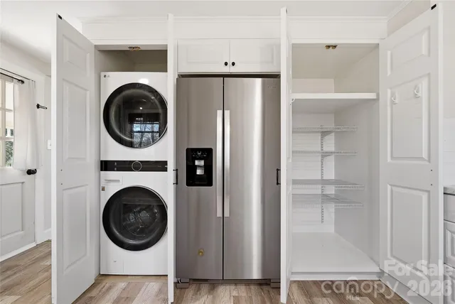 a view of a hallway with washer and dryer