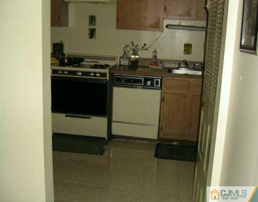1929 Raspberry Court Edison, NJ 08817 - Photo 5 of 8 a kitchen with a stove and a refrigerator