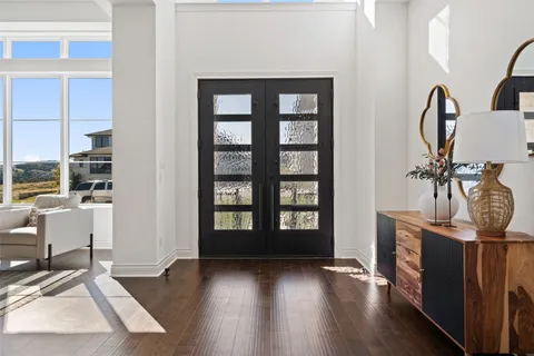 a view of a livingroom with furniture and windows
