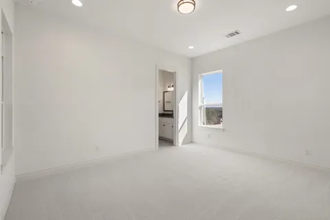a bathroom with a shower and a sink